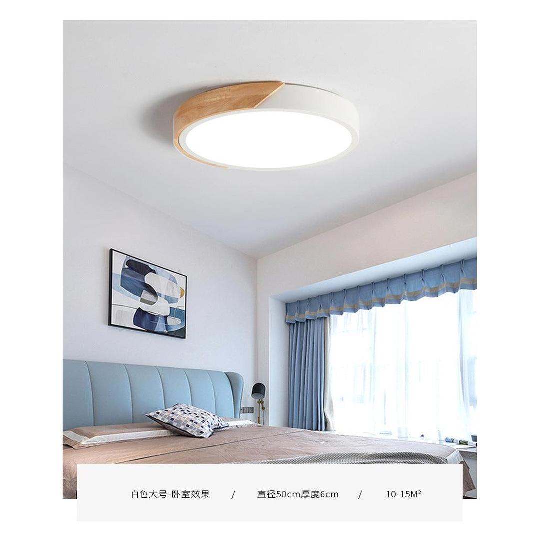 Rund LED-taklampe i akryl med farget metallkant